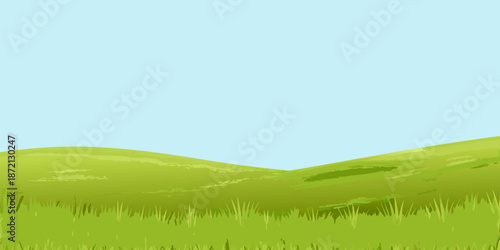 A simple landscape with rolling green hills and a light blue sky