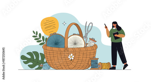 Woman stands next to a large wicker basket filled with embroidery hoops, thread, and scissors in a creative setting.