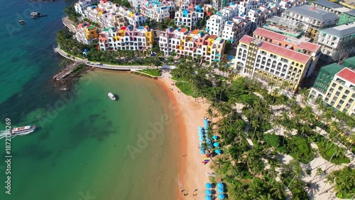 Wallpaper Mural Phu Quoc, Sunset Town, Vietnam. 4k high-quality footage taken with a Drone showcasing colorful buildings, blue skies, a watch tower, a kissing bridge, turquoise clear waters, green forest, golden sand Torontodigital.ca