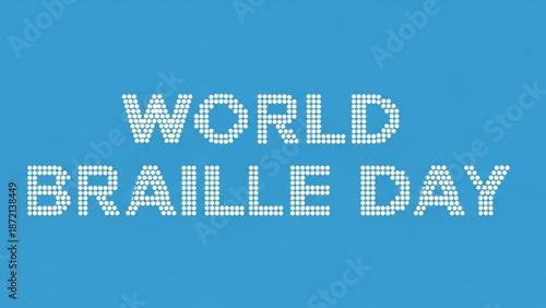 World braille day awareness sign with white braille dots on blue background with accessibility and disability and inclusion and equality and empowerment
