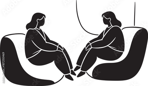 Two women sitting in modern chairs talking