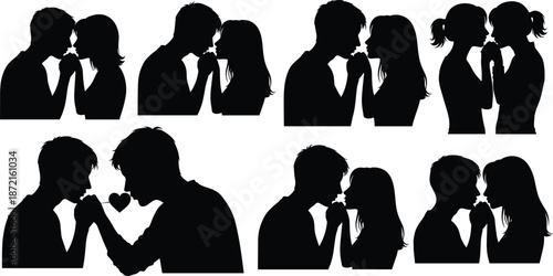 Silhouettes of couples kissing with heart symbol in black and white