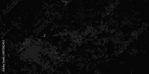 A dark textured background with a grainy speckled appearance throughout