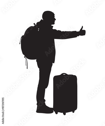 Silhouette of a traveler with a backpack and suitcase hitchhiking on a road.
