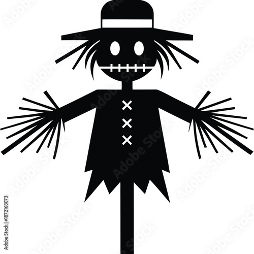 Silhouette shows a traditional scarecrow wearing a hat with stitched facial features and straw hair