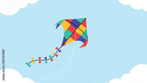 Bright colorful kite with a long tail flying high in a blue sky with white clouds for outdoor activity and childhood fun concepts.