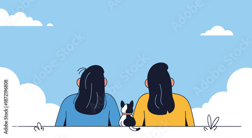 Rear view of two women sitting peacefully on a field with their cat while looking at the vast blue sky and white clouds during a sunny day.