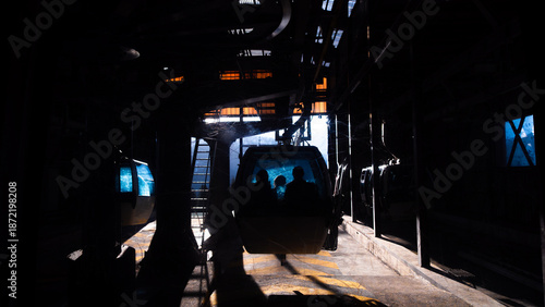 Gandola of skilift inside upper base on the winter ski resort in Italy during day light