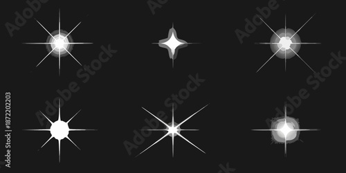 Collection of sparkling starbursts and light flares on a dark background