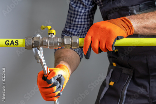  Technician repairing gas pipeline.  A specialist checks the gas pipeline.
