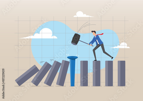 Businessman Stopping Domino Effect with a Nail