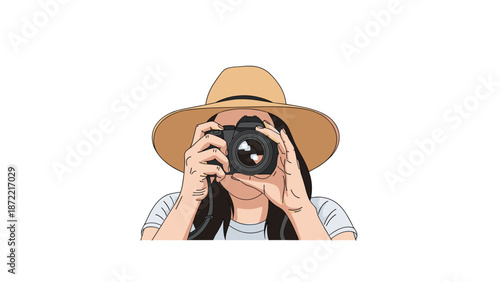 Young woman wearing a large straw hat is holding a professional camera to her eye while focusing on capturing a beautiful moment outdoors.