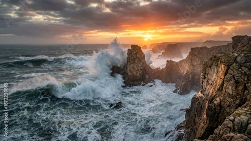 A dramatic sunset over a rocky coastline with powerful waves crashing against the cliffs.