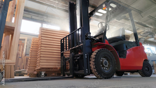 Manipulator lifting elevator loader in the workshop industrial environment