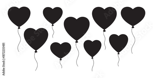 Collection of black heart shaped balloons floating with strings on white background, romantic celebration party decor elements