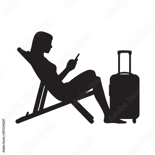 Silhouette of a woman relaxing on a lounge chair with suitcase