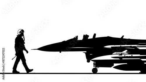 Military pilot walking towards fighter jet on runway