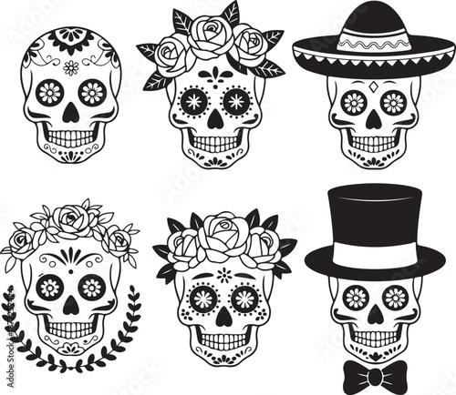 sugar skulls with floral and hat decorations