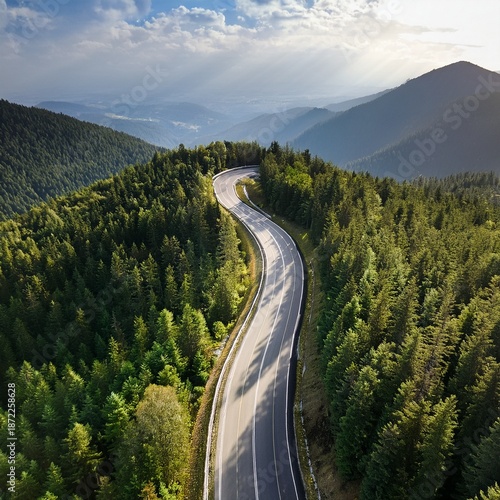 Aerial View of Scenic Winding Mountain Road Through Dense Green Forest, Curved Highway Landscape in Summer Nature, Drone Photography of Serpentine Road in Hills, Travel and Transportation Concept