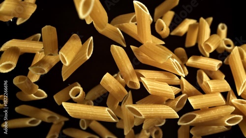 Super slow motion flying dry penne pasta . Filmed on a high-speed camera at 1000 fps. High quality FullHD footage