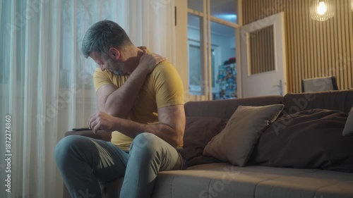 Arm, shoulder and pain of man in home with stress, joint inflammation and arthritis risk. Health, injury and closeup of person with muscle ache, wound and anxiety for first aid, fracture or emergency