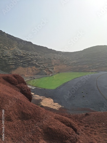 Lanzarote volcanic Lake and ocean beach in El Golfo, Canary Islands, Spain. Charco de los Clicos
