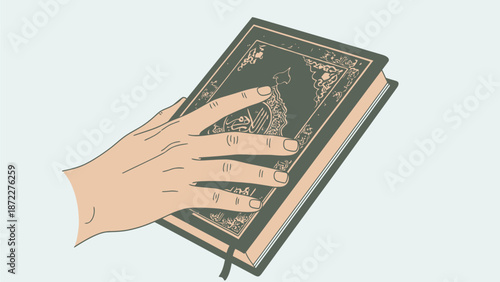 Hand holding a green leather bound journal