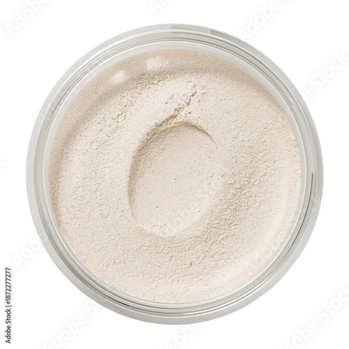Loose Powder Sits in Round Container With a Smooth Surface and Light Color