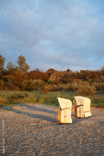 A few beach chairs alone on the beach on the Darß Peninsula, Germany, vertical view