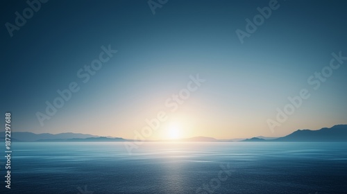 Serene Sunrise Over Misty Mountainous Waterscape