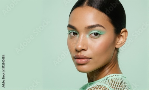 Modern Minimalist Beauty Shot: Mint Green Tones and Sleek Hair