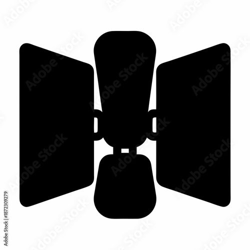 Black silhouette of studio lighting equipment with barn doors on a white backdrop