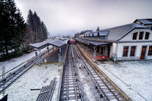Chamonix-Mont-Blanc train station with red trains, France, Alps. French tourist means of transport.