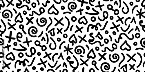 A chaotic pattern of hand drawn symbols and doodles on a white background