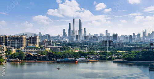 Scenic panoramic view of Guangzhou city skyline and river in China during a clear day.