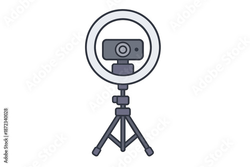 Camera on a tripod with a ring light set up for video recording in a home studio space