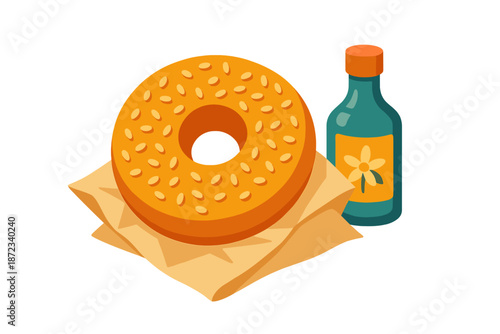 Fresh bagel with sesame seeds and a small bottle of sauce on a paper napkin ready to be served