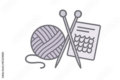 Knitting supplies on a table with yarn, knitting needles, and a pattern sheet for creating projects