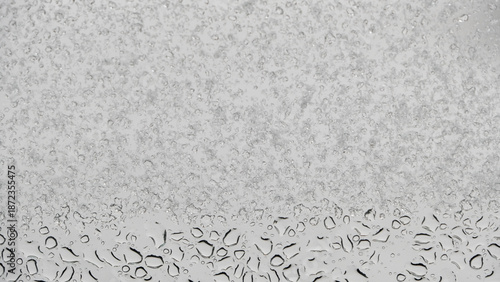 water droplets and snowflakes on the window