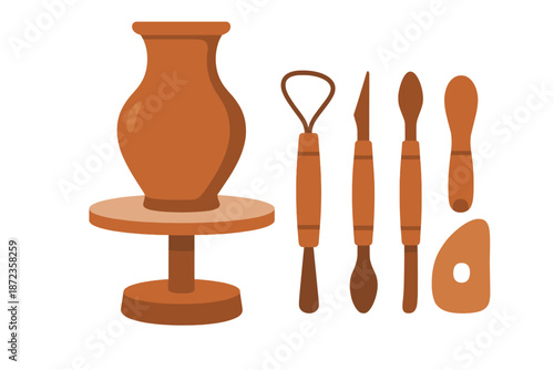 Pottery tools and a designed vase placed on a potter's wheel in a studio setting during the day