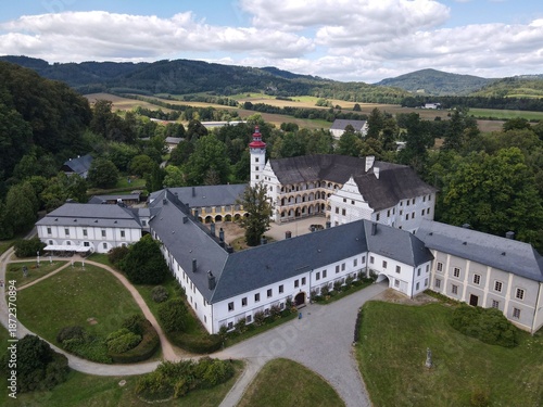 Aerial view of the town of Velké Losiny in the foothills of the Jeseníky Mountains. Drone view of Velké Losiny Castle and the castle garden.