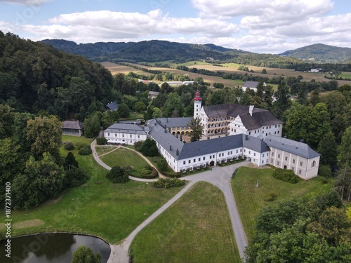 Aerial view of the town of Velké Losiny in the foothills of the Jeseníky Mountains. Drone view of Velké Losiny Castle and the castle garden.