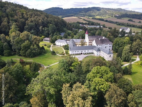 Aerial view of the town of Velké Losiny in the foothills of the Jeseníky Mountains. Drone view of Velké Losiny Castle and the castle garden.