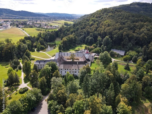 Aerial view of the town of Velké Losiny in the foothills of the Jeseníky Mountains. Drone view of Velké Losiny Castle and the castle garden.