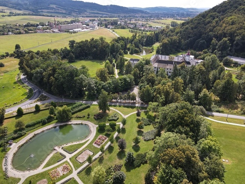 Aerial view of the town of Velké Losiny in the foothills of the Jeseníky Mountains. Drone view of Velké Losiny Castle and the castle garden.