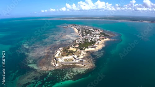 Aerial view of the Fortress of Sao Sebastiao, with a historic fort and houses on the island set against the turquoise ocean, Nampula, Nampula Province, Mozambique.