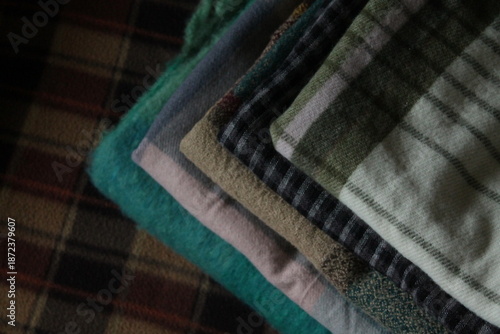 stack of colorful plaid scarves