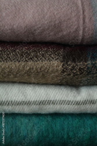 stack of colorful plaid scarves