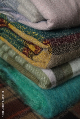 stack of colorful plaid scarves