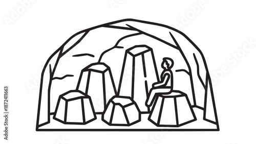 A person sitting on a rock in a cave surrounded by stones